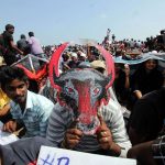 Chennai: People in large numbers stage a demonstration in favour of Jallikattu in Chennai on Jan 21, 2017. (Photo: Parthibhan/IANS) by .