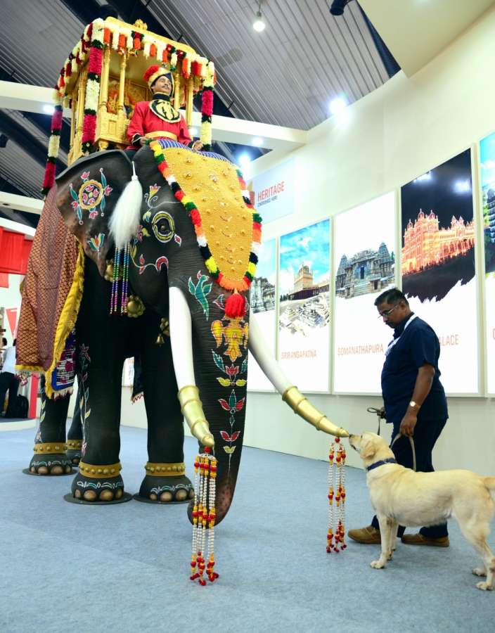Bengaluru : A sniffer dog checks out a model of an elephant placed at the Pravasi Bharatiya Divas being held in Bengaluru on Jan. 7, 2017. (Photo: IANS)