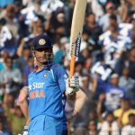 Cuttack: MS Dhoni of India raises his bat to celebrate his half-century during the Second One Day International cricket match between India and England at Barabati Stadium in Cuttack on Jan 19, 2017. (Photo: Surjeet Yadav/IANS) by .