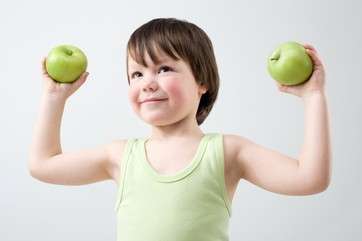Boy holding apples