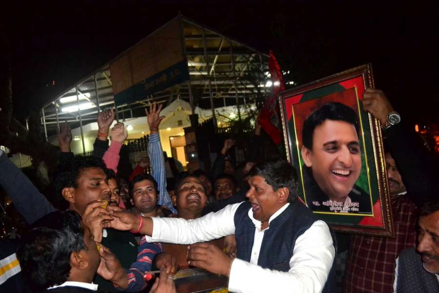 Agra: Supporters of Akhilesh Yadav celebrate after the Election Commission recognized the faction led by him as the Samajwadi Party and allotted it the 'cycle' symbol in Agra on Jan 16, 2017. (Photo: Pawan Sharma/IANS) by .
