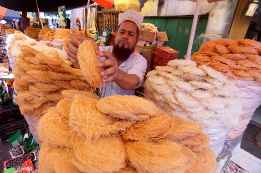 Guwahati: A shopkeeper sells vermicelli at Fancy Bazar of Guwahati ahead of Eid al-Adha on Sept 9, 2016. (Photo: IANS)
