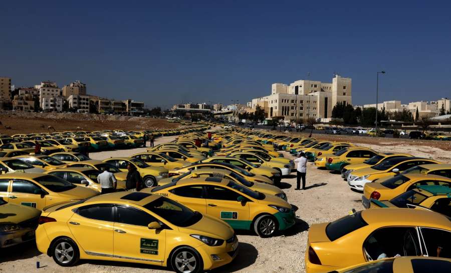AMMAN, Nov. 15, 2016 (Xinhua) -- A large number of taxi vehicles are seen during a protest by taxi drivers in Tabarbour area, eastern Amman, on Nov. 15, 2016. The taxi drivers protested against the ride sharing service, Uber, which has harmed their daily earnings, and called on the government to meet their demands. The demands include increasing taxi fares, providing taxi drivers with health insurance coverage and registering them as subscribers to the Social Security Corporation (SSC). (Xinhua/Mohammad Abu Ghosh/IANS)