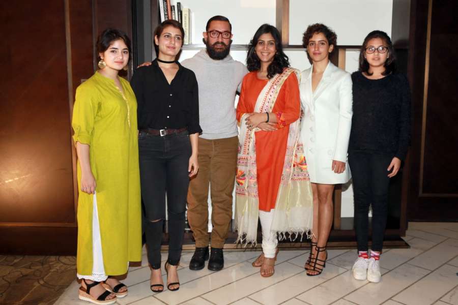 New Delhi: Actors Zaira Wasim, Fatima Sana Shaikh, Aamir Khan, Sakshi Tanwar, Sanya Malhotra and Suhani Bhatnagar during a press conference to promote film "Dangal" in New Delhi on Dec 27, 2016. (Photo: Amlan Paliwal/IANS) by .