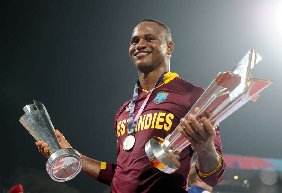 Kolkata: Marlon Samuels of West Indies celebrates after winning the World T20 2016 against England at Eden Gardens in Kolkata, on April 3, 2016. (Photo: IANS) by .