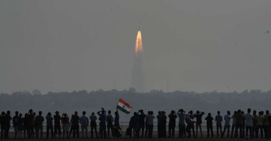 Chennai: People watch as Indian rocket Polar Satellite Launch Vehicle (PSLV) lifts off successfully from Sriharikota with a record 104 satellites, including the country's earth observation satellite Cartosat-2 series; at Marina Beach, Chennai on Feb 15, 2017. (Photo: IANS) by .