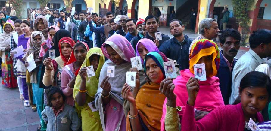 Agra: People stand in a queue to cast their vote in the first phase of the Uttar Pradesh assembly elections in Agra on Feb 11, 2017. (Photo: IANS) by .