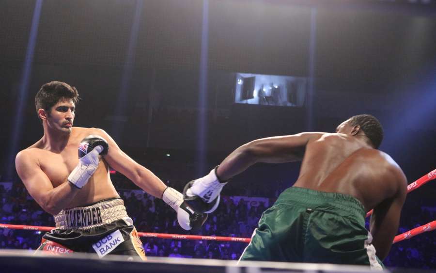 New Delhi: India's Vijender Singh and Tanzania's Francis Cheka in action during WBO Asia Pacific Super Middleweight title match at the Thyagaraj Stadium in New Delhi on Dec. 17, 2016. Vijender retains WBO Asia Pacific Super Middleweight title. (Photo: IANS) by .
