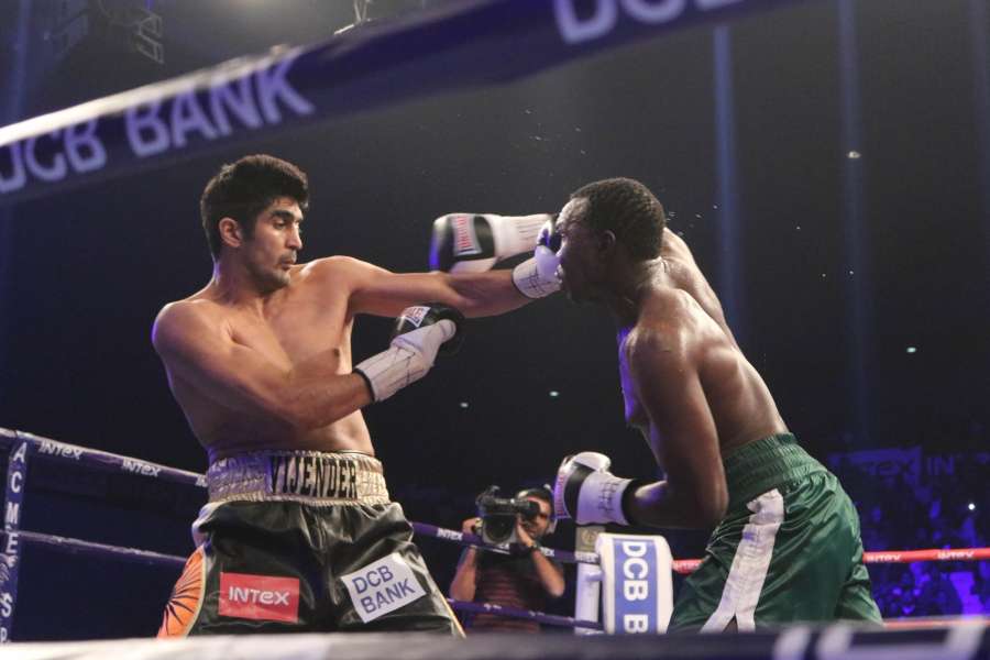 New Delhi: India's Vijender Singh and Tanzania's Francis Cheka in action during WBO Asia Pacific Super Middleweight title match at the Thyagaraj Stadium in New Delhi on Dec. 17, 2016. Vijender retains WBO Asia Pacific Super Middleweight title. (Photo: IANS) by .