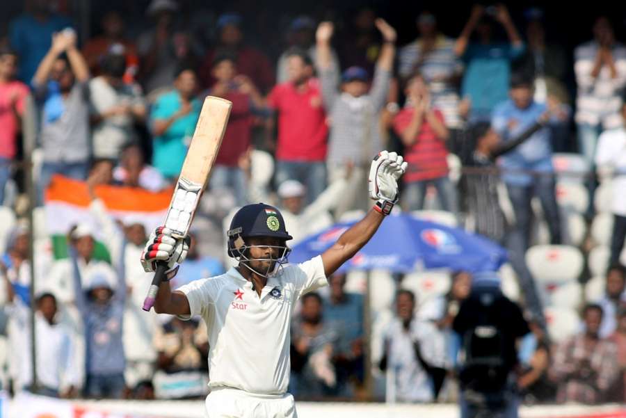 Hyderabad: India's Wriddhiman Saha raises his bat to celebrate his century on the second day of the only test match between India and Bangladesh in Hyderabad on Feb. 10, 2017. (Photo: Surjeet Yadav/IANS) by .