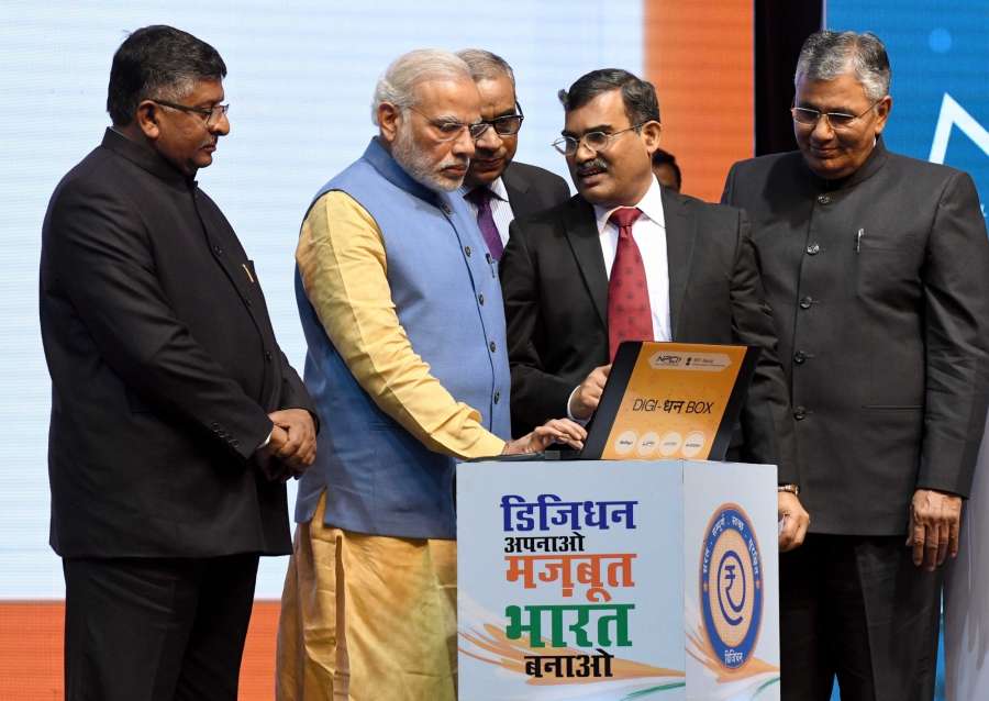 New Delhi: Prime Minister Narendra Modi inaugurates the first weekly draw for Lucky Grahak Yojana and DigiDhan Vyapar Yojana to encourage digital payments during the DigiDhan Mela in New Delhi on Dec 30, 2016. Also seen Union Minister for Electronics & Information Technology and Law & Justice Ravi Shankar Prasad and Minister of State for Electronics & Information Technology and Law & Justice PP Chaudhary. (Photo: IANS) by .