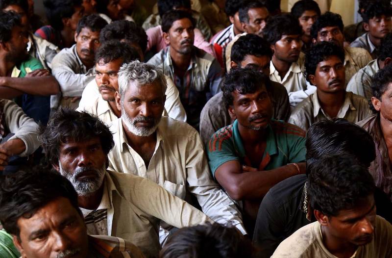 KARACHI, March 31, 2016 (Xinhua) -- Arrested Indian fisherman sit at a police station in southern Pakistani port city of Karachi on March 31, 2016. Pakistan's Maritime Security Agency has arrested 59 Indian fishermen and seized ten boats for allegedly fishing in Pakistani waters. (Xinhua/Arshad/IANS) by .