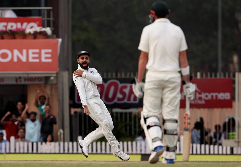 Ranchi: Indian captain Virat Kohli gestures towards Australia's Matt Renshaw as Kohli runs to celebrate the dismissal of David Warner during the fourth day of the third test cricket match in Ranchi on March 19, 2017. (Photo: Surjeet Yadav/IANS) by .