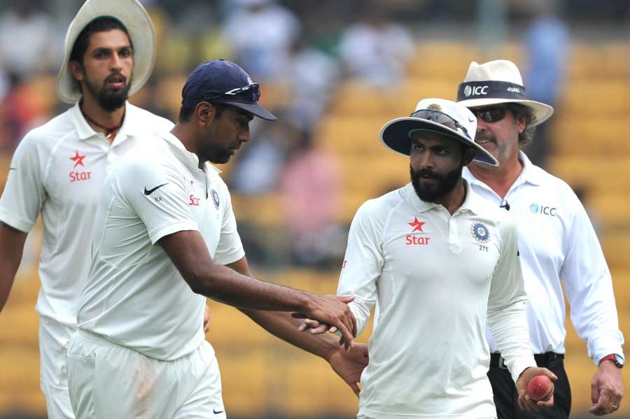 Bengaluru: Indian spinner R Ashwin congratulates Ravindra Jadeja on taking 6 wickets on day three of second test match between India and Australia at M. Chinnaswamy Stadium, in Bengaluru on March 6, 2017. (Photo: IANS) by .