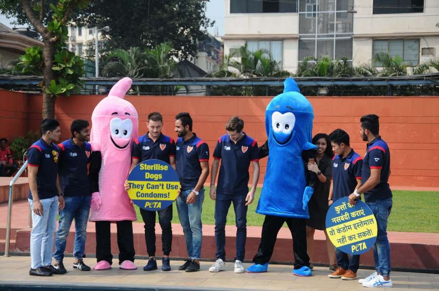 Mumbai: Hockey India League team Dabang Mumbai press for sterilisation of dogs during a PETA programme in Mumbai, on Jan 18, 2017. (Photo: IANS) by .