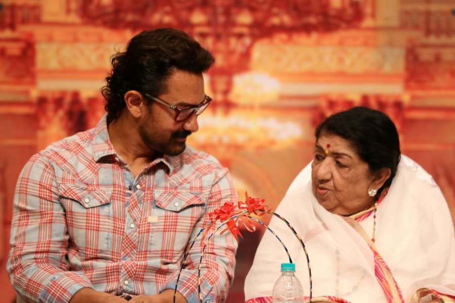 Mumbai: Actors Aamir Khan and singer Lata Mangeshkar during the Master Dinanath Mangeshkar Purashkar in Mumbai on April 24, 2017. (Photo: IANS) by .