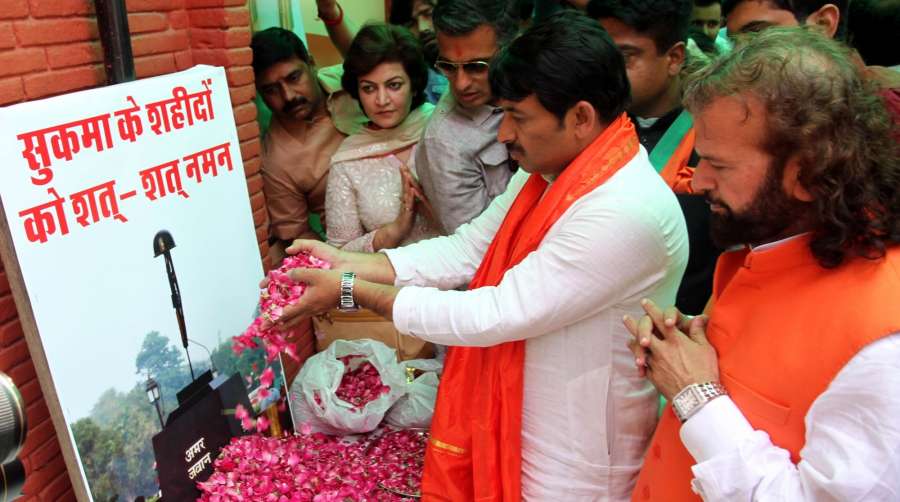 New Delhi: Delhi BJP chief Manoj Tiwari and sufi singer and party leader Hans Raj Hans pay tributes to the martyred CRPF personnel in New Delhi on April 26, 2017. 25 CRPF personnel were killed in a Maoist attack that took place in Chattisgarh's Sukma on 24th April 2017. (Photo: IANS) by .
