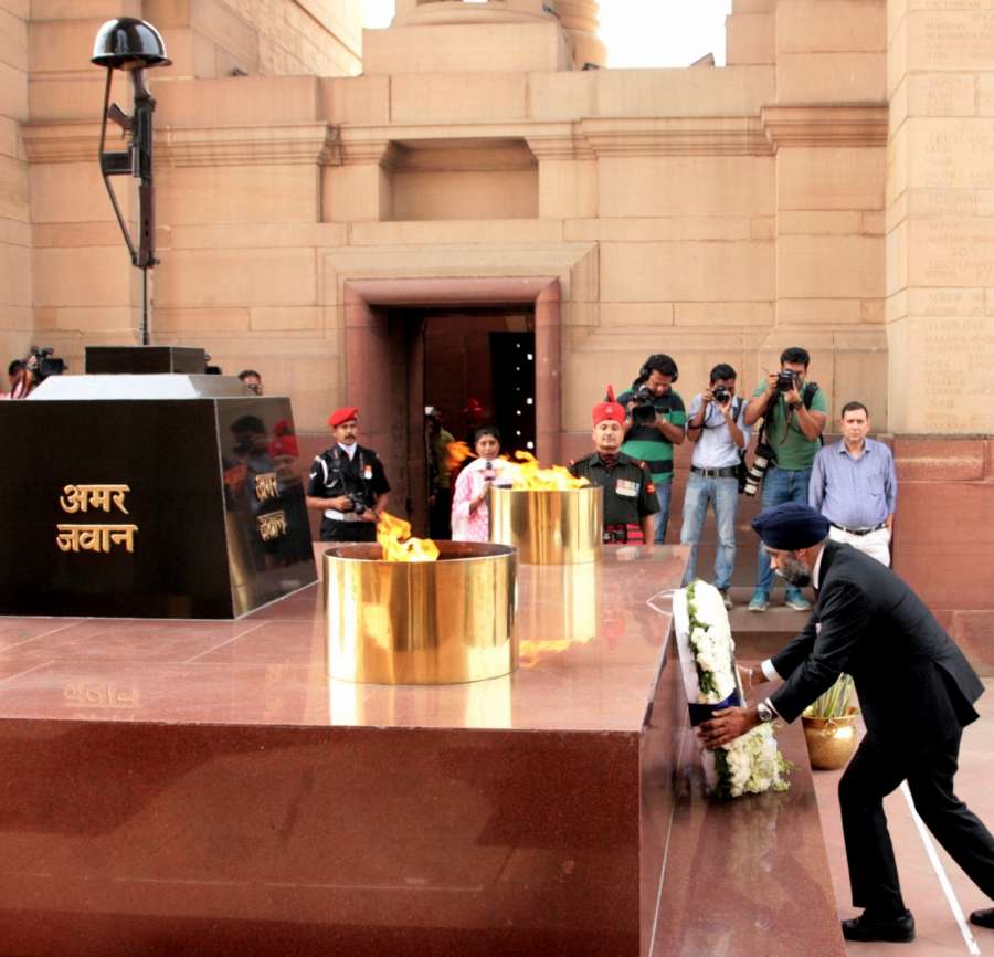 New Delhi: Canada Defence Minister Harjit Singh Sajjan lays wreath at Amar Jawan Jyoti, India Gate, in New Delhi on April 18, 2017. (Photo: IANS/PIB) by .