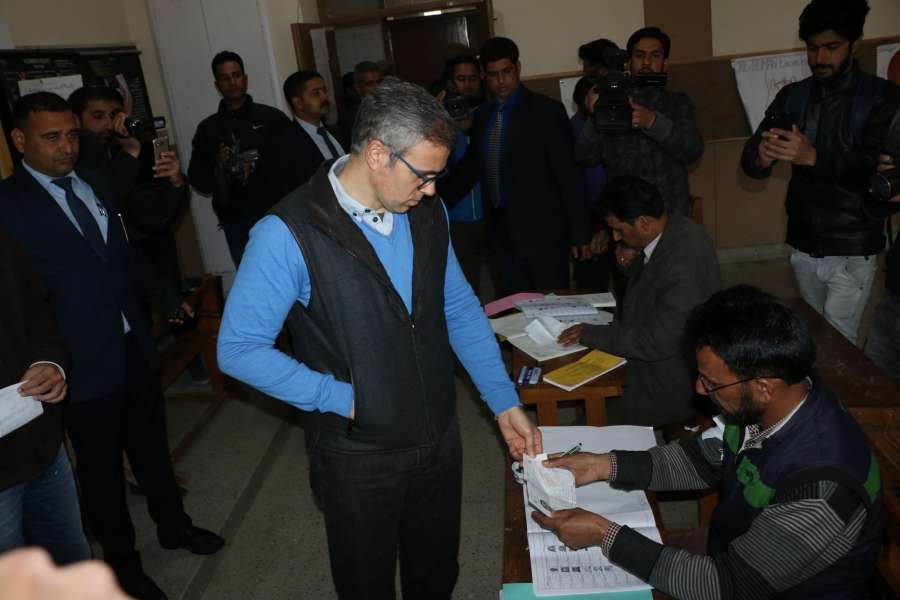 Srinagar: Omar Abdullah arrives to cast his vote at a polling booth during Srinagar Lok Sabha by-poll, in Srinagar on April 9, 2017. (Photo: IANS) by .