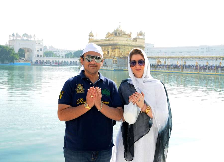 Amritsar: Singer and composer Adnan Sami and his wife Roya Faryabi pays obeisance at the Golden Temple in Amritsar on Dec 4, 2014. (Photo: IANS) by .