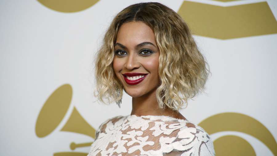 Image: Beyonce poses backstage after performing at the 56th annual Grammy Awards in Los Angeles by .