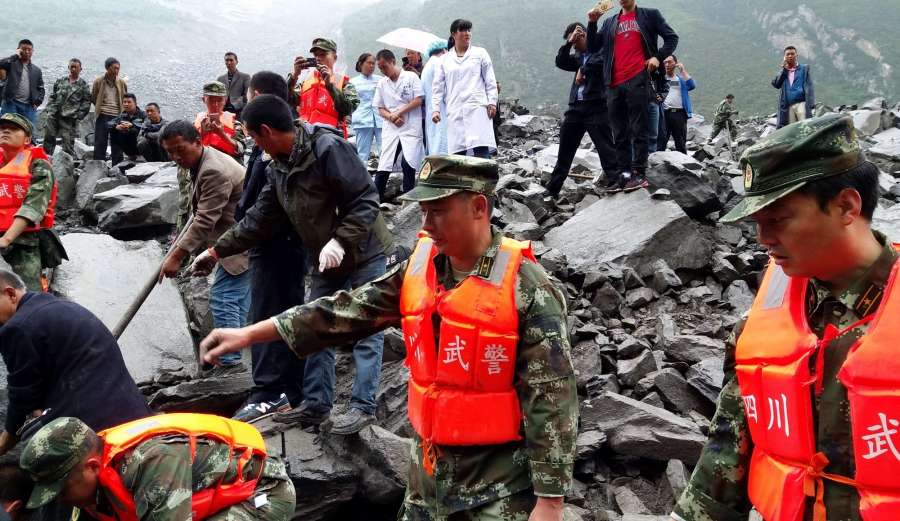 ABA, June 24, 2017 (Xinhua) -- Photo taken by a cellphone shows rescuers working at the accident site after a landslide occurred in Xinmo Village of Maoxian County, Tibetan and Qiang Autonomous Prefecture of Aba, southwest China's Sichuan Province, June 24, 2017. The landslide on Saturday morning smashed some 40 homes, where about 100 people are feared to be buried. (Xinhua/Zheng Lei/IANS) by .