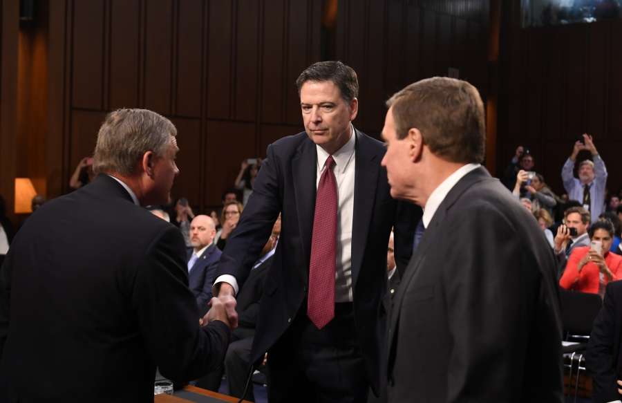 WASHINGTON, June 8, 2017 (Xinhua) -- Former Director of Federal Bureau of Investigations James Comey (C) is welcomed by Senate Intelligence Committee members before a hearing on Capitol Hill, in Washington D.C., the United States, on June 8, 2017. James Comey said Thursday during a Senate hearing that Trump in his words did not order the FBI to drop the investigation on former National Security Advisor Michael Flynn. Comey testified that even though Trump's words were not "an order", he nevertheless "took it as a direction." (Xinhua/Yin Bogu/IANS) by .