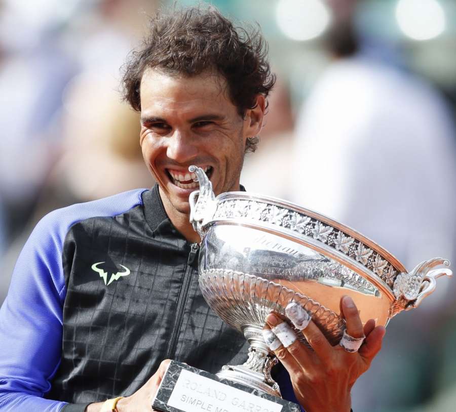 PARIS, June 12, 2017 (Xinhua) -- Rafael Nadal of Spain celebrates with his trophy after the men's singles final with Stan Wawrinka of Switzerland at French Open tennis tournament 2017 at Roland Garros, in Paris, France on June 11, 2017. Nadal won 3-0 to c by .