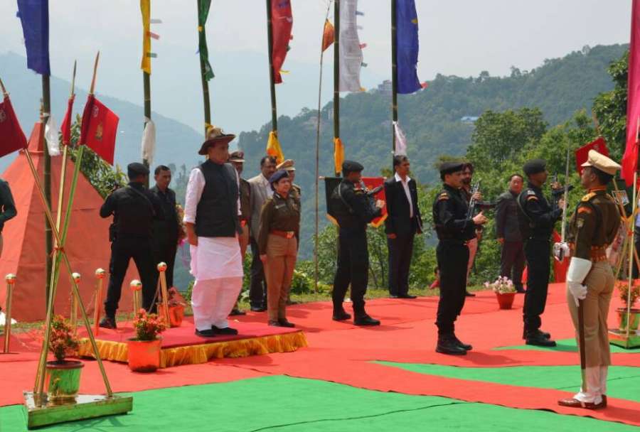 Sikkim: Union Home Minister Rajnath Singh takes salute, during his visit to the Sashastra Seema Bal's 36th Batallion at Gayzing, in Western District of Sikkim on May 21, 2017. (Photo: IANS/PIB) by .