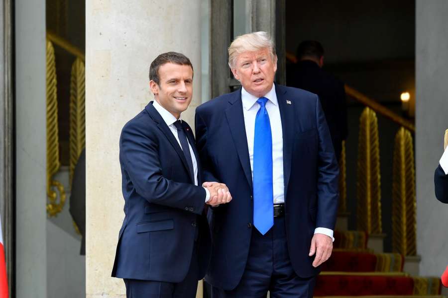 PARIS, July 13, 2017 (Xinhua) -- French President Emmanuel Macron (L) shakes hands with U.S. President Donald Trump at the Elysees Palace in Paris, France, on July 13, 2017. U.S. President Donald Trump arrived in Paris on Thursday morning in a diplomatic move to soften divergence with France over climate change and trade liberalization by seeking common ground on security and fight against terrorism. (Xinhua/Chen Yichen/IANS) by .