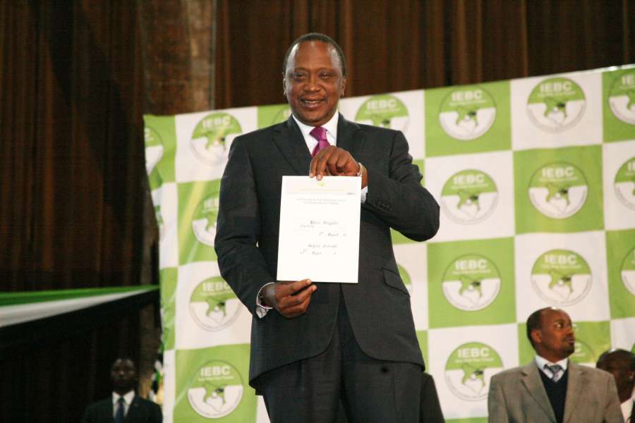 NAIROBI, Aug. 11, 2017 (Xinhua) -- Kenyan President Uhuru Kenyatta shows the certificate as the winner of presidential elections in Nairobi, capital of Kenya, on Aug. 11, 2017. Kenyan President Uhuru Kenyatta was on Friday declared the winner of Tuesday's presidential elections with 8.20 million (54.27 percent) votes against 6.76 million (44.74 percent) for his main challenger, Raila Odinga after a tense electoral process which was preceded by an opposition walkout. (Xinhua/Charles Onyango/IANS) by .