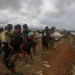 Dakhinpara: Rohingya refugees arrive at Shah Porir Dwip in Dakhinpara ofBangladesh from Rasidong in Myanmar, on Sept 13, 2017. (Photo: bdnews24/IANS) by .