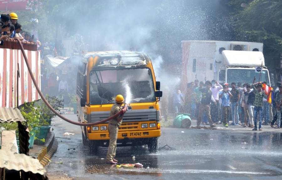 Agra: A bus torched by protesters during a nation wide strike called to protest against the dilution of the SC/ST Prevention of Atrocities Act in Agra, on April 2, 2018. (Photo: IANS) by .