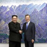 Panmunjom: South Korean President Moon Jae-in (R) shakes hands with North Korean leader Kim Jong-un ahead of a landmark summit at the Peace House in the truce village of Panmunjom on April 27, 2018. (Yonhap/IANS) by .