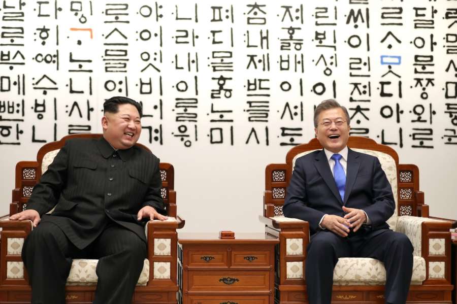Panmunjom: South Korean President Moon Jae-in (R) and North Korean leader Kim Jong-un burst into laughter as they talk ahead of a landmark summit at the Peace House in the truce village of Panmunjom on April 27, 2018.(Yonhap/IANS) by .