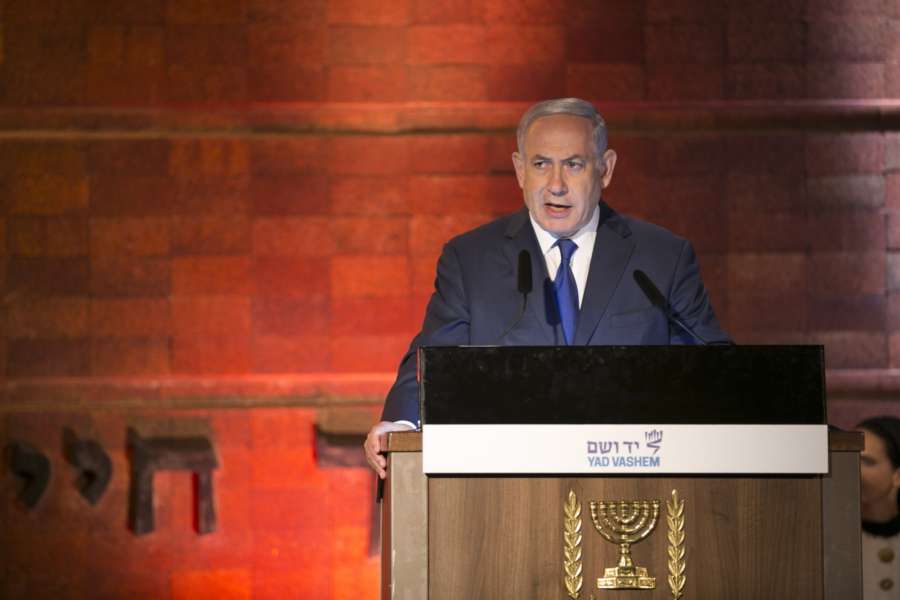 JERUSALEM, April 11, 2018 (Xinhua) -- Israeli Prime Minister Benjamin Netanyahu speaks at an official ceremony marking the Holocaust Remembrance Day at Yad Vashem World Holocaust Remembrance Center in Jerusalem, on April 11, 2018. Israel marked its annual day of Holocaust remembrance on Wednesday evening with an official ceremony held in Jerusalem. (Xinhua/Du Zhen/IANS) by .