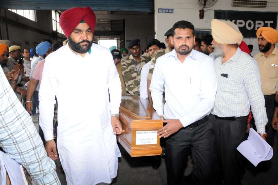 Amritsar: Coffin of one of the 39 Indian men killed by the Islamic State in Iraq's Mosul in 2014 arrives in Amritsar on April 2, 2018. Although 39 Indians were killed as the Islamic State took over Mosul, the mortal remains of 38 were brought back as the identification of one body is still pending. (Photo: IANS) by .