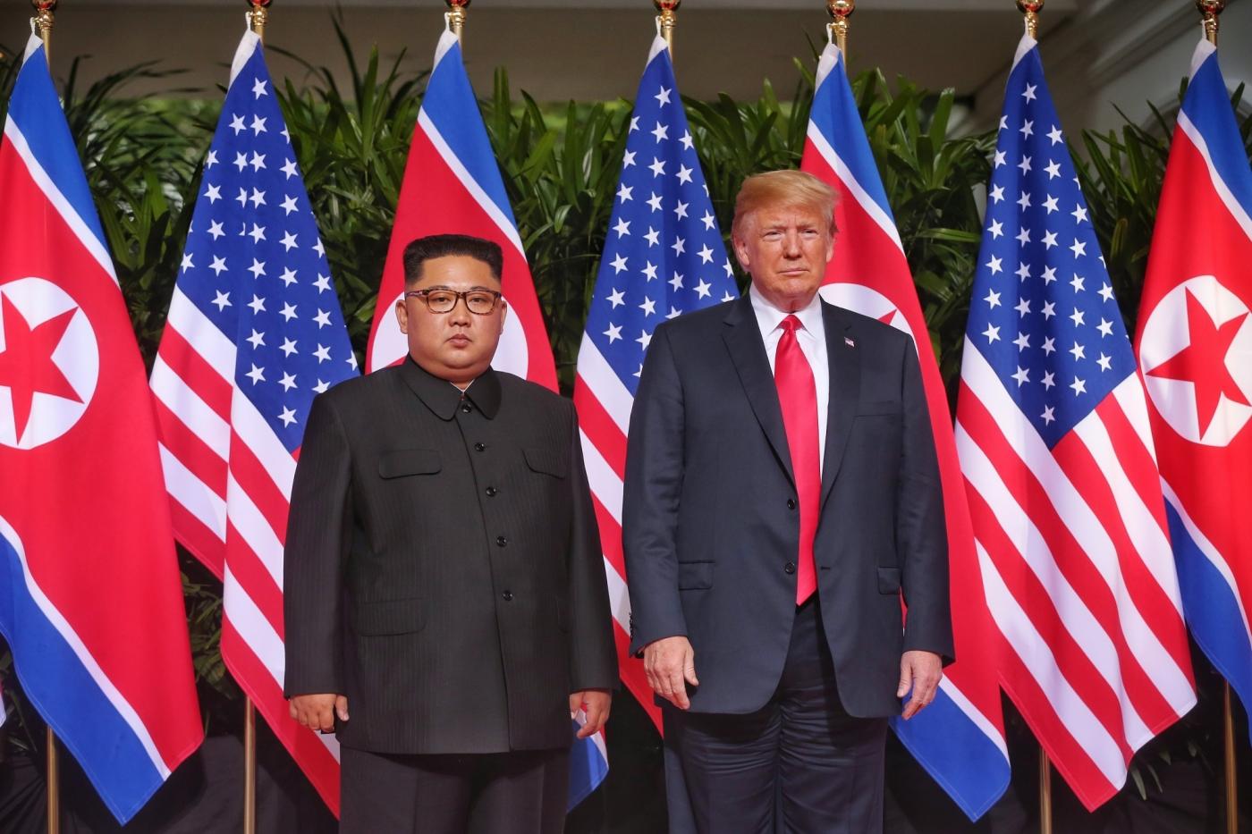 SINGAPORE, June 12, 2018 (Xinhua) -- Top leader of the Democratic People's Republic of Korea (DPRK) Kim Jong Un (L) meets with U.S. President Donald Trump in Singapore, on June 12, 2018. (Xinhua/The Straits Times/IANS) by .