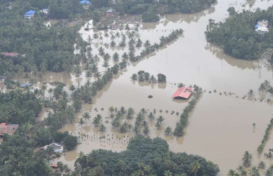 Kerala: An aerial view of the flood-hit areas of Kerala on Aug 18, 2018. Overflowing rivers and a series of landslides have caused the death of 180 people as of Saturday morning, with over three lakh people forced to move to some 2,000 relief camps. The disaster has triggered an unprecedented rescue and relief operation led by the Army, the Air Force and the Navy along with teams of National Disaster Response Force involving about 1,300 personnel and 435 boats. Prime Minister Narendra Modi on Saturday announced Rs 500 crore financial assistance for flood-ravaged Kerala. (Photo: IANS/PIB) by .