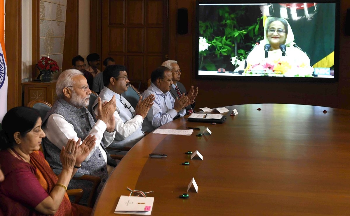 New Delhi: Prime Minister Narendra Modi and his Bangladeshi counterpart Sheikh Hasina jointly unveil e-plaques for the ground-breaking ceremony of two projects - India-Bangladesh Friendship Pipeline and Dhaka-Tongi-Joydebpur Railway Project via video conferencing, in New Delhi on Sept 18, 2018. Also seen External Affairs Minister Sushma Swaraj and Union Petroleum and Natural Gas and Skill Development and Entrepreneurship Minister Dharmendra Pradhan. (Photo: IANS/PIB) by .