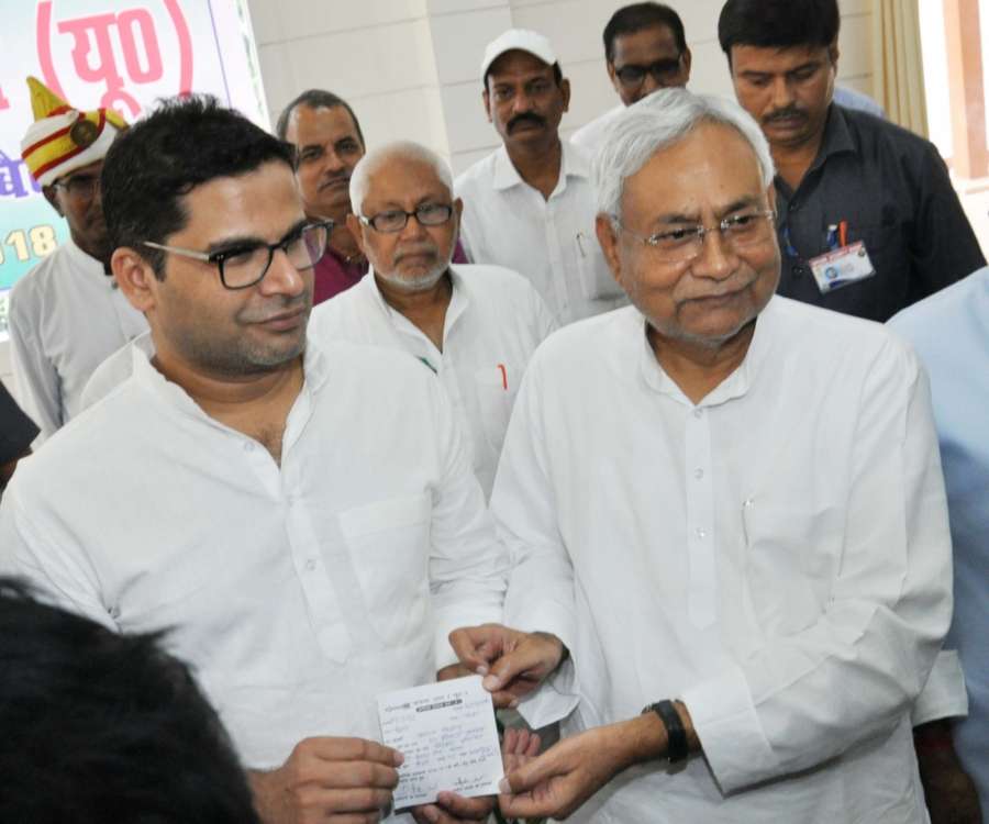 Patna: Bihar Chief Minister and JD-U chief Nitish Kumar with election strategist Prashant Kishor during a programme where the latter joined JD-U, in Patna on Sept 16, 2018. Kishor, 41-year-old former UN official, who founded the Indian Political Action Committee (I-Pac), was tasked with running the JD-U's campaign during the 2015 Bihar polls after he parted ways with the Bharatiya Janata Party (BJP). (Photo: IANS) by .