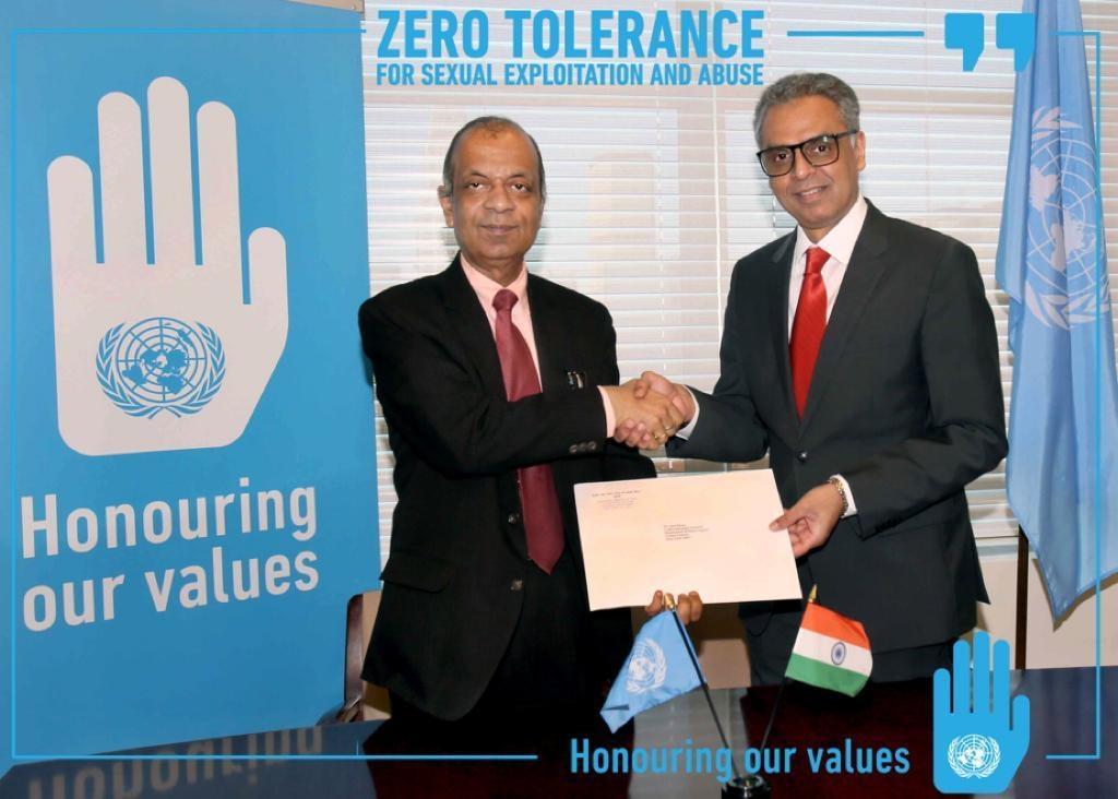 The United Nations Under-Secretary-General for Field Operations, Atul Khare, left, receives India's contribution of $300,000 from India's Permanent Representative Syed Akbaruddin. The contribution is for the UN's "Pipeline to Peacekeeping Command Programme." (Photo: Indian Mission/IANS) by .