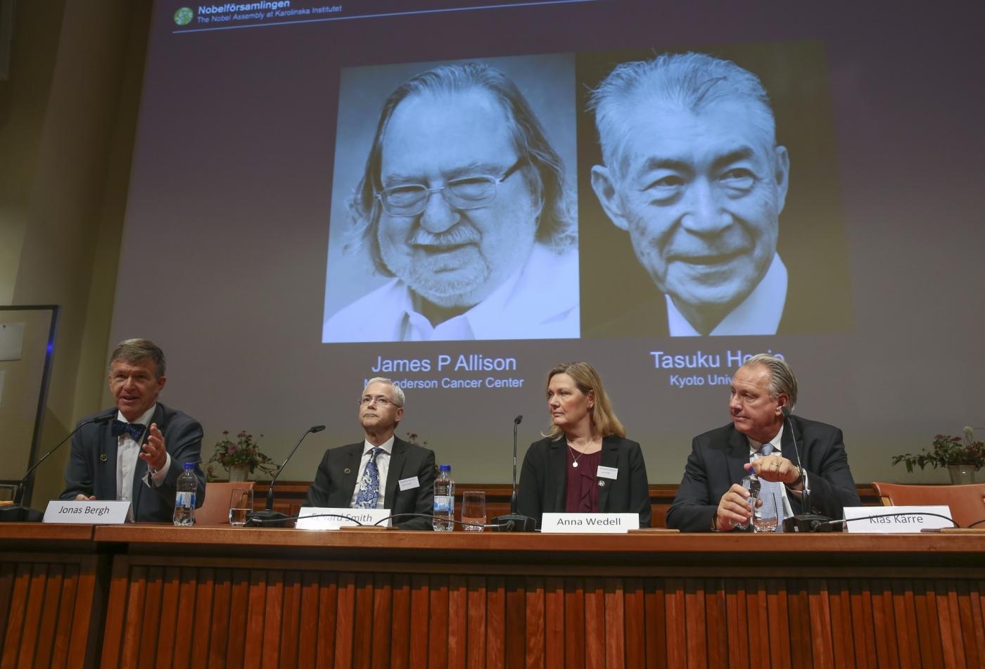 STOCKHOLM, Oct. 1, 2018 (Xinhua) -- Members of the Nobel Committee for Physiology or Medicine announce two scientists James P. Allison (L, screen) of U.S. and Tasuku Honjo (R, screen) of Japan share 2018 Nobel Prize in Physiology or Medicine during a press conference at the Karolinska Institute in Stockholm, Sweden, on Oct. 1, 2018. The Nobel assembly at the Karolinska Institute has decided to award the 2018 physiology or medicine prize jointly to James P. Allison and Tasuku Honjo for their discovery of cancer therapy by inhibition of negative immune regulation. (Xinhua/Ye Pingfan/IANS) by .