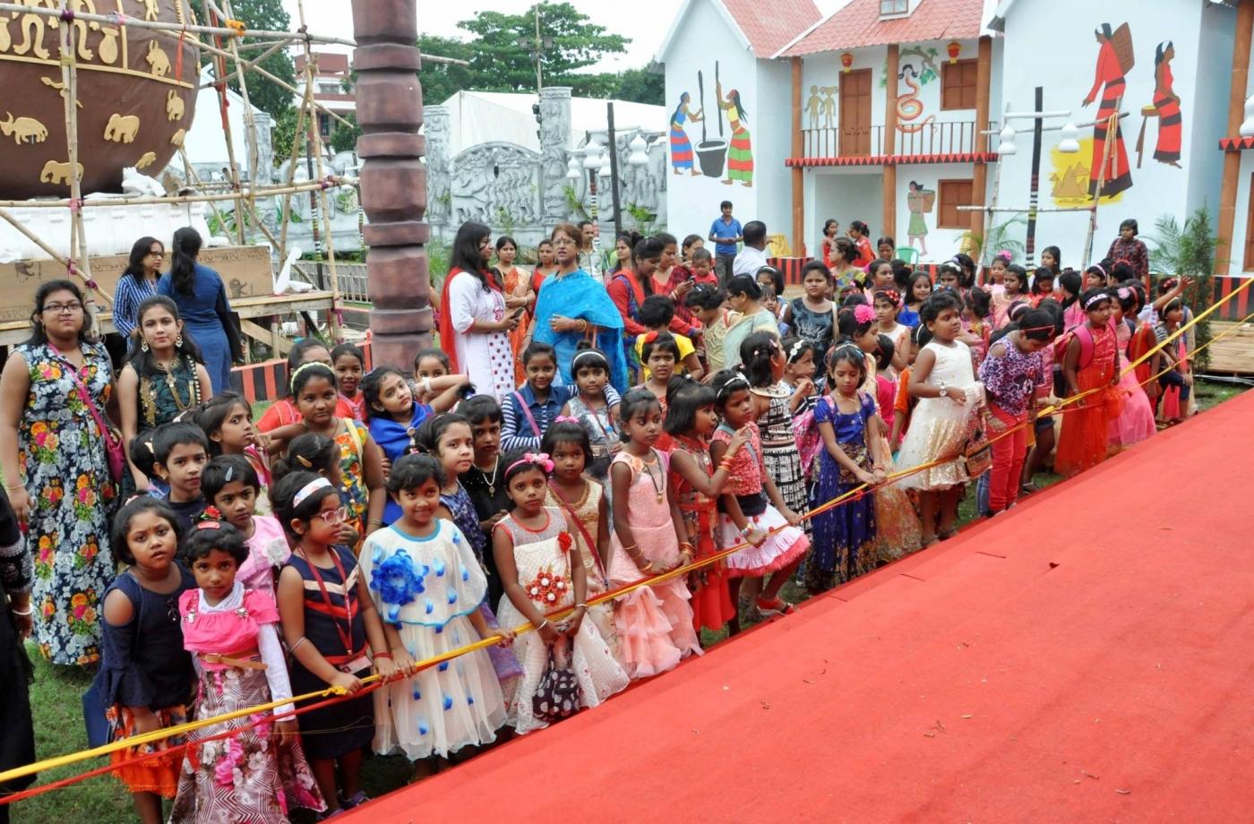 Kolkata: Children visit a puja pandal during Durga Puja celebrations organised by Saltlake BJ block Sarodutsav committee in collaboration with Chinese embassy in Kolkata ahead of the festival, on Oct 13, 2018. (Photo: Kuntal Chakrabarty/IANS) by .