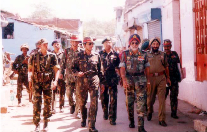 Army Commander Lt Gen G.S. Sihota (right) visits a troubled area to take stock of the situation, after the Godhra riots in 2002. (Photo Courtesy: Konark Publishers) by .