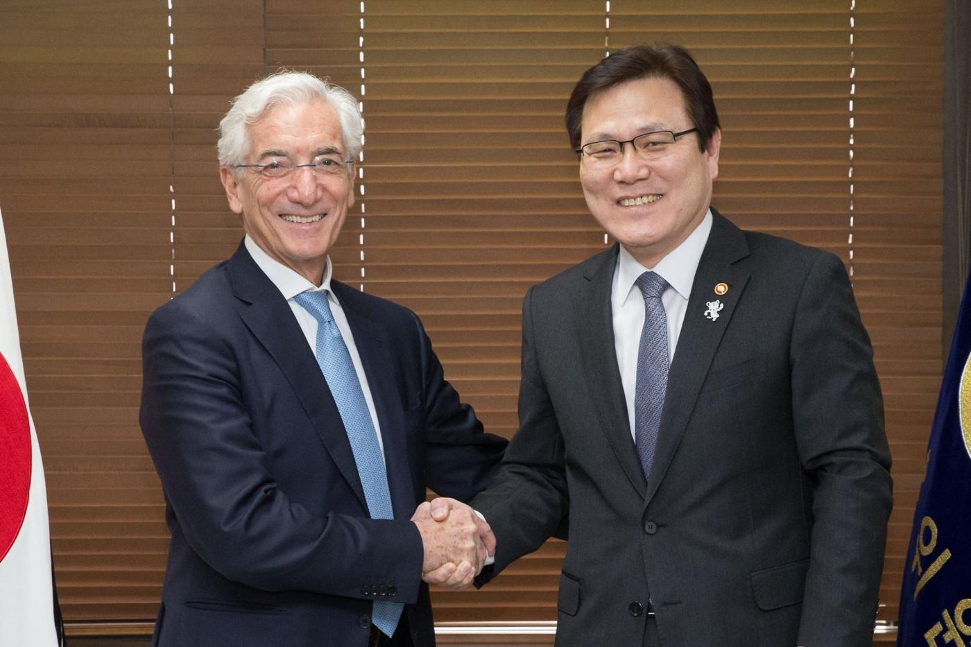 Seoul: Financial Services Commission (FSC) Chairman Choi Jong-ku (R) shakes hands with Ronald Cohen, chairman of the Global Social Impact Investment Steering Group (GSG), during their meeting in Seoul on Feb. 22, 2018, in this photo provided by the FSC.(Yonhap/IANS) by .