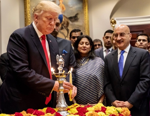 United States President Donald Trump lights a lamp during the White House Diwali celebrations on Tuesday, Nov. 13, 2018, in Washington. (Photo: White House/IANS) by .