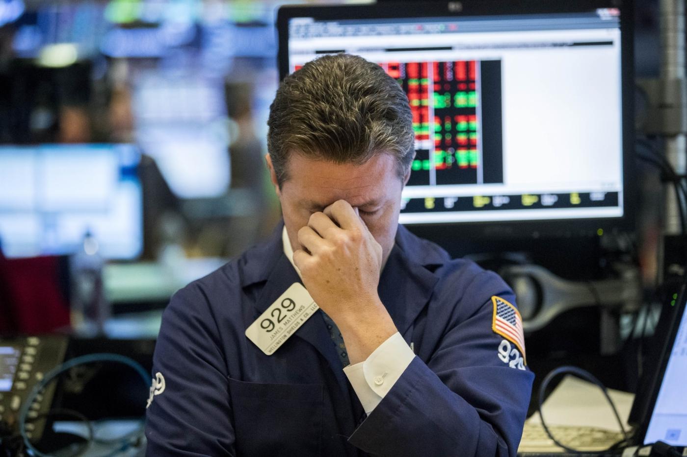NEW YORK, Oct. 11, 2018 (Xinhua) -- A trader reacts at the New York Stock Exchange in New York, the United States, on Oct. 11, 2018. U.S. stocks extended deep losses in volatile trading on Thursday. The Dow Jones Industrial Average fell 545.91 points, or 2.13 percent, to 25,052.83. The S&P 500 was down 57.31 points, or 2.06 percent, to 2,728.37. The Nasdaq Composite Index was down 92.99 points, or 1.25 percent, to 7,329.06. (Xinhua/Wang Ying/IANS) by .