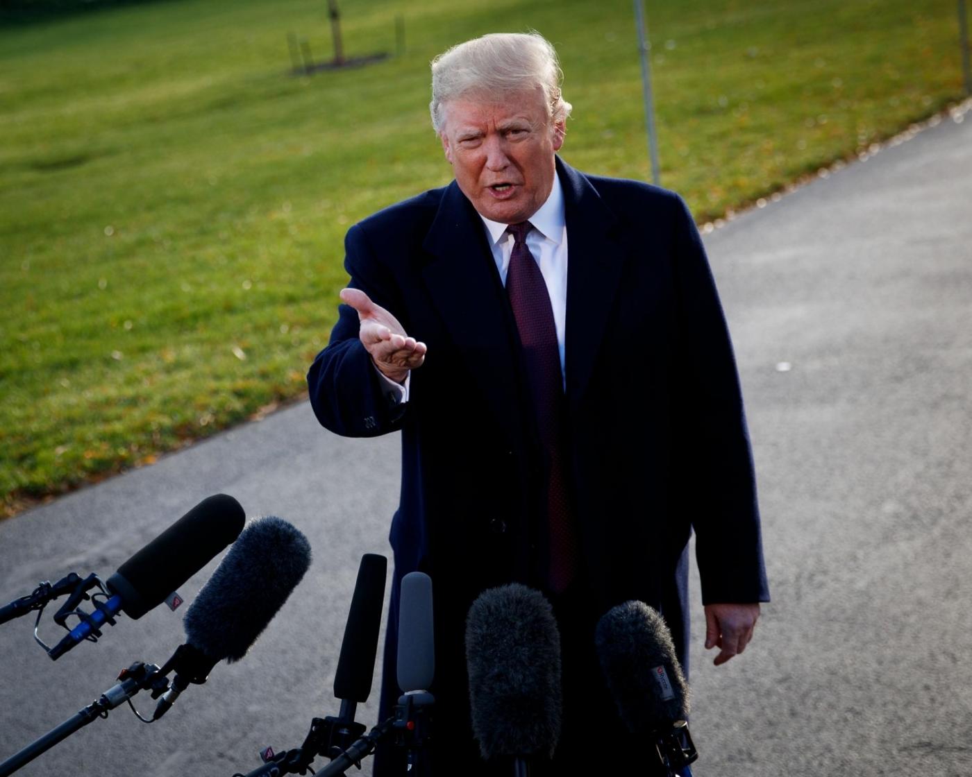 WASHINGTON, Nov. 20, 2018 (Xinhua) -- U.S. President Donald Trump speaks to reporters before departing from the White House in Washington D.C., the United States, on Nov. 20, 2018. Donald Trump has submitted written answers to questions from Special Counsel Robert Mueller probing into the alleged Russian meddling in the 2016 U.S. elections, local media on Tuesday quoted the president's attorneys as saying. (Xinhua/Ting Shen/IANS) by .