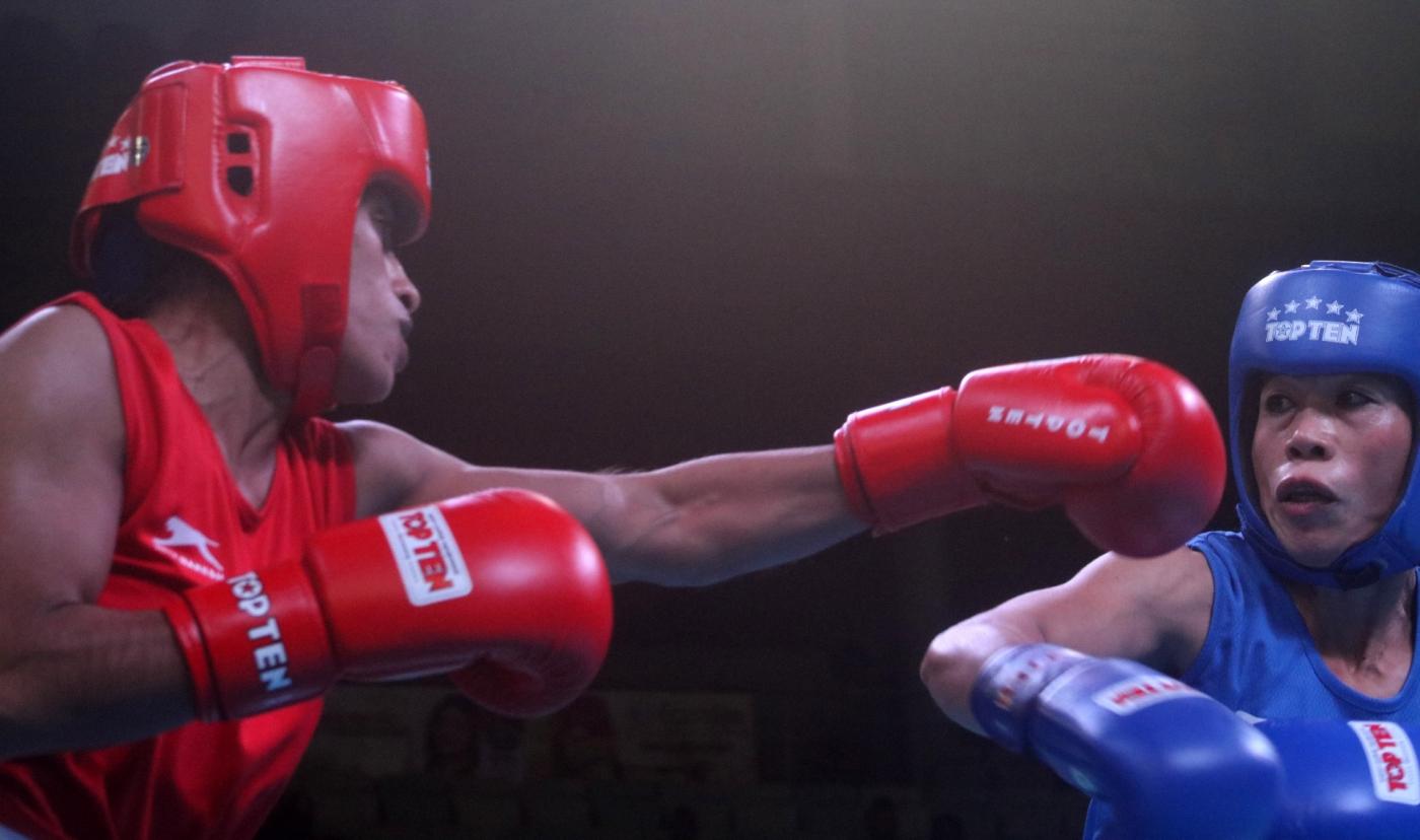 New Delhi: Choudhary Varsha (Red) and M C Mary Kom (Blue) of India in action during the 1st India Open international boxing tournament in New Delhi, on Jan 28, 2018. (Photo: Bidesh Manna/IANS) by .
